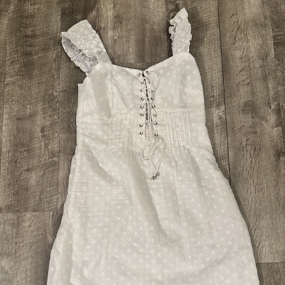White, open back, corset style dress